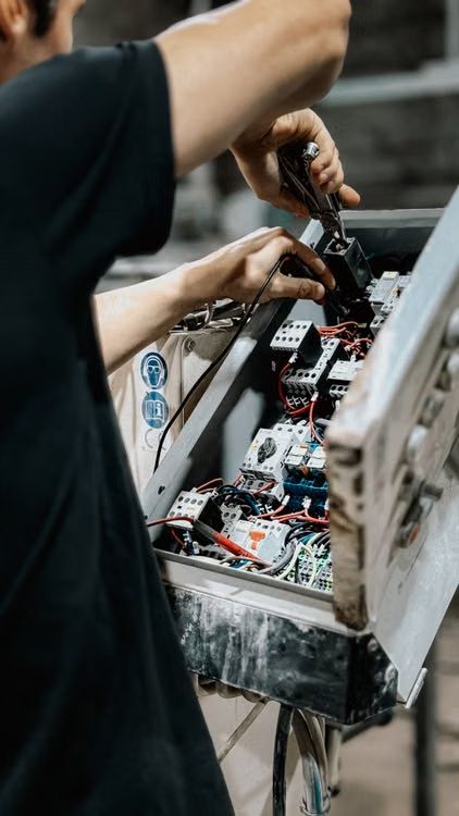 Sample photo: electrician wiring a control box