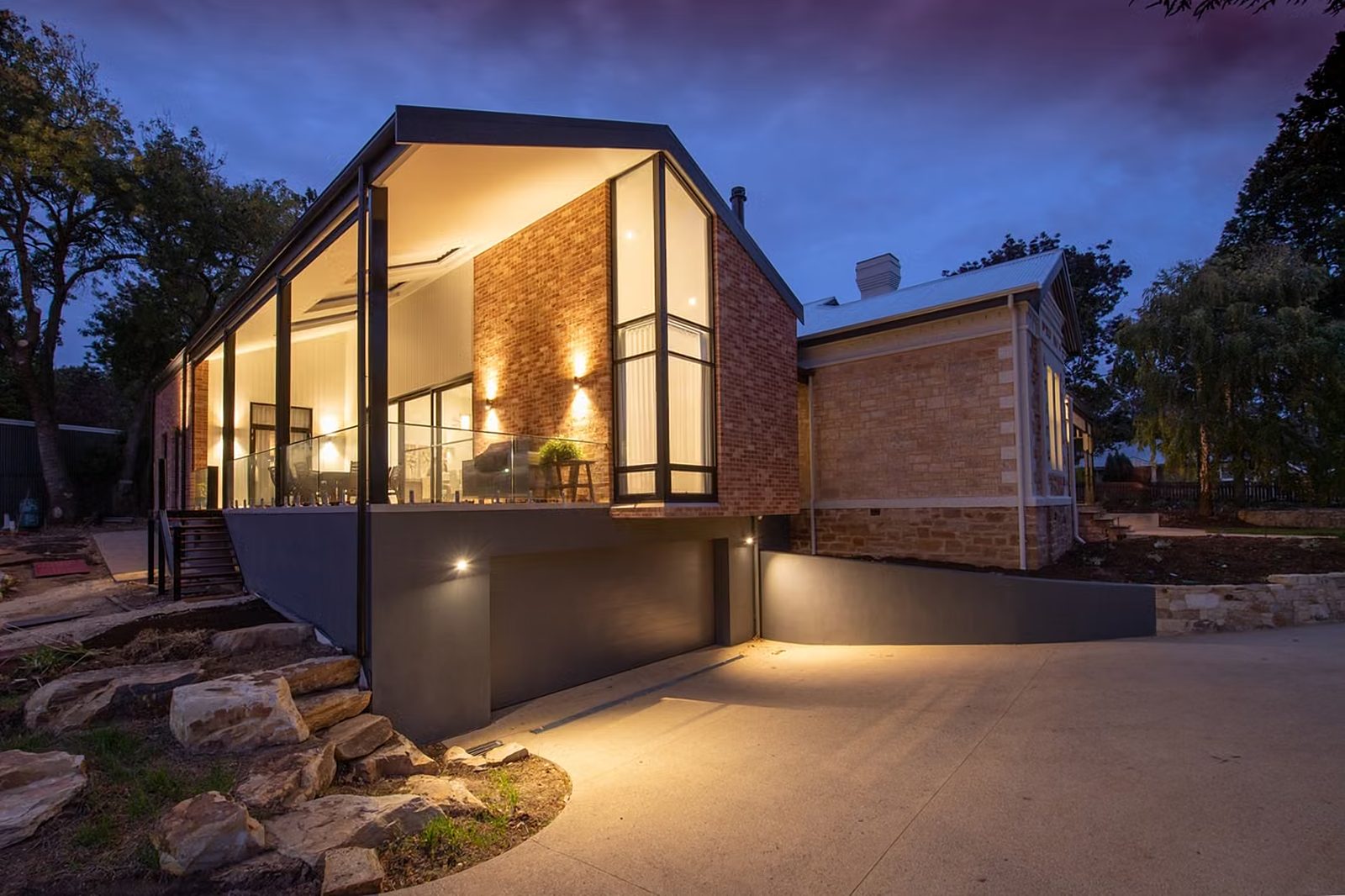 Sample photo: house with warm interior and exterior lighting at dusk